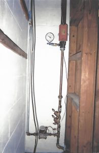The fire sprinkler system riser located in the home .