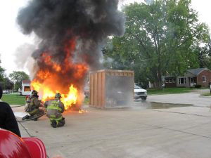 Side-by-side fire and sprinkler burn demonstration held during the Redford Township Fire Department Open House.